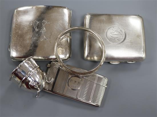 Two silver cigarette cases, a silver card case, a silver egg cup and a silver bracelet.